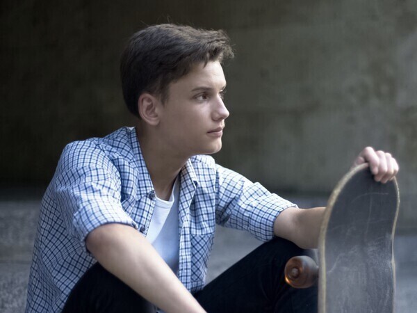 teen with skateboard